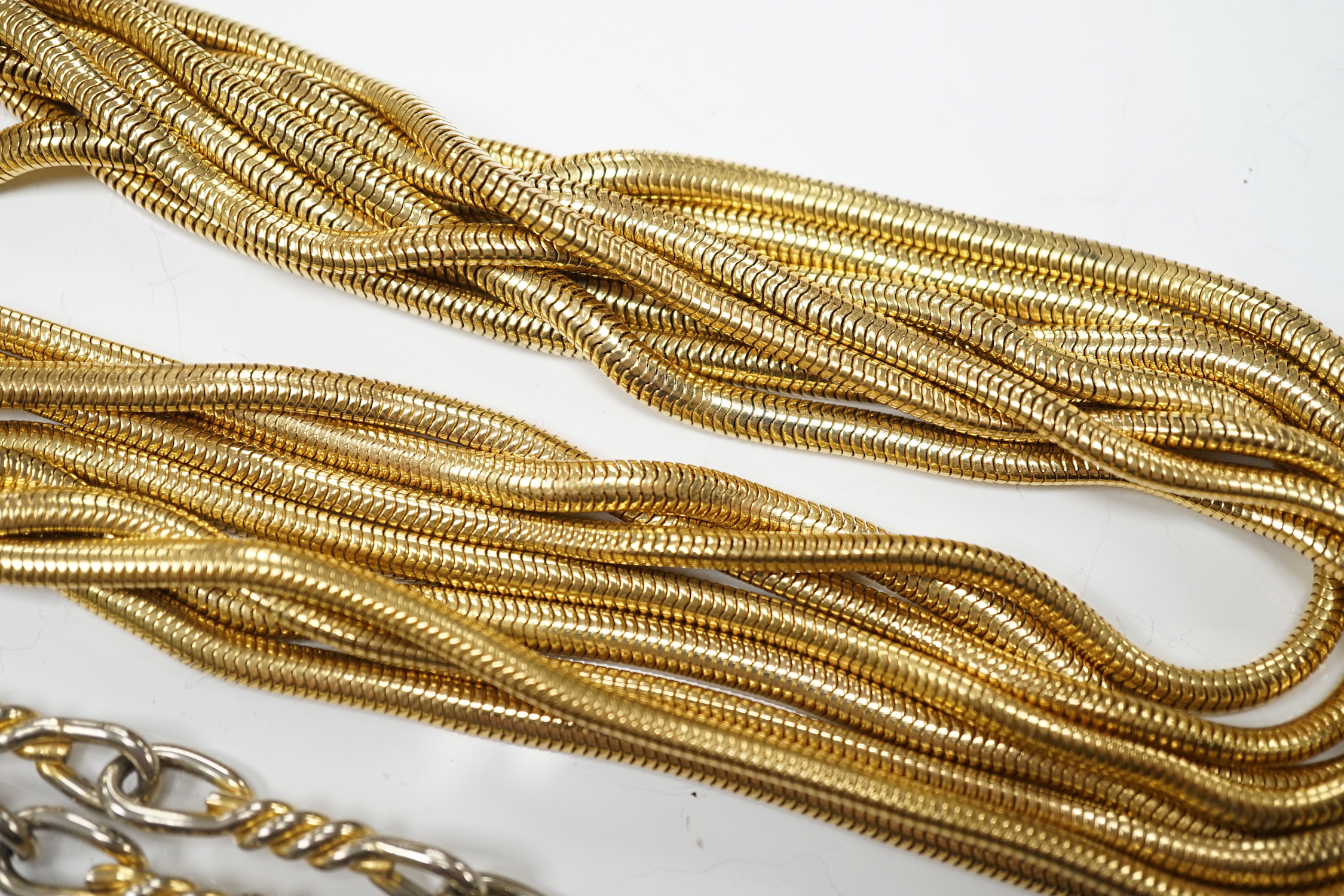 A Christian Dior multi strand gilt metal snake link necklace, 90cm, together with a Christian Dior two colour metal spiral chain link necklace, 78cm, both signed.